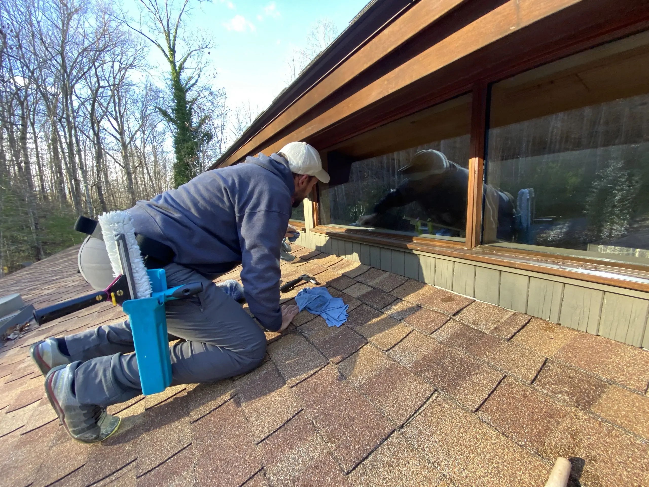 Team member cleaning a window